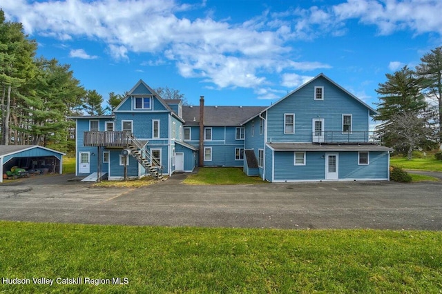 996 Dominican Ln, Saugerties, NY 12477 - back of house featuring stairs, a yard, and a wooden deck