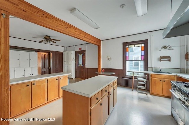 996 Dominican Ln, Saugerties, NY 12477 - kitchen with gas stove, a wainscoted wall, light countertops, beamed ceiling, and ceiling fan