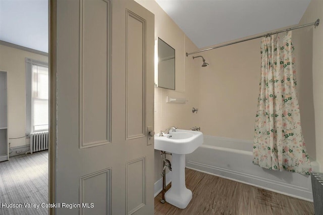 996 Dominican Ln, Saugerties, NY 12477 - bathroom featuring radiator, shower / bath combo, and wood finished floors