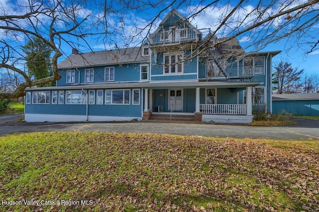 996 Dominican Ln, Saugerties, NY 12477 - victorian house featuring a balcony, a porch, and asphalt driveway