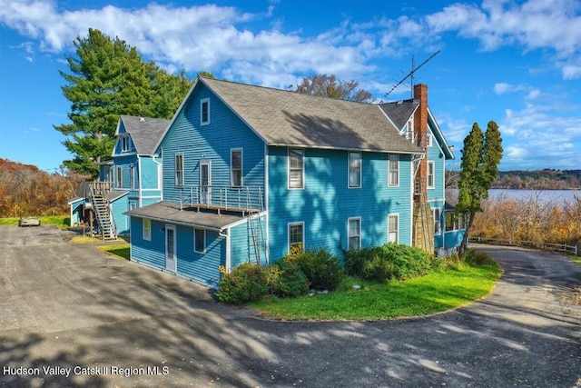996 Dominican Ln, Saugerties, NY 12477 - view of side of property featuring a chimney, driveway, and stairway