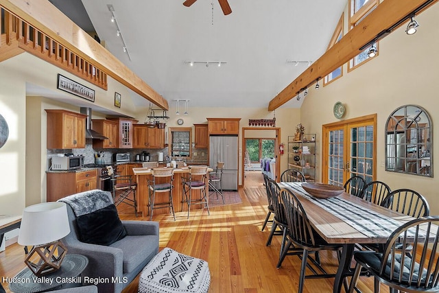 dining room with light hardwood / wood-style floors, french doors, and ceiling fan