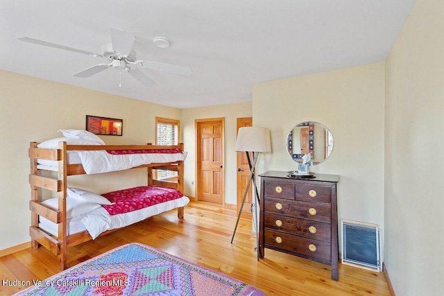 bedroom with ceiling fan and light hardwood / wood-style flooring