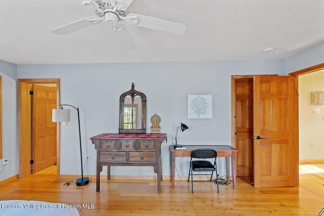 miscellaneous room featuring ceiling fan and light hardwood / wood-style floors