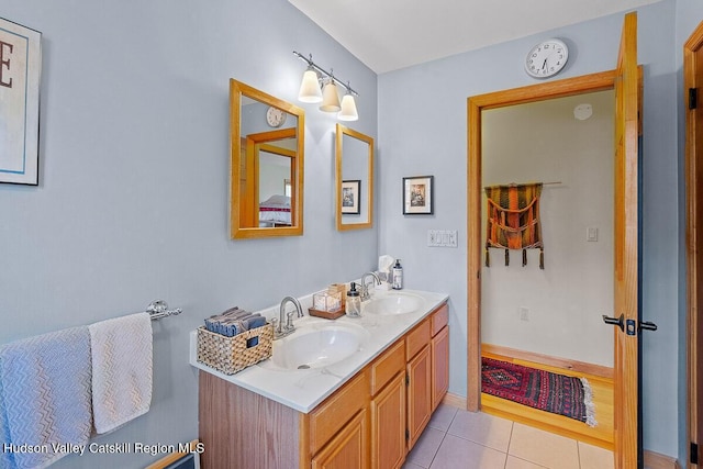 bathroom featuring tile patterned flooring and vanity