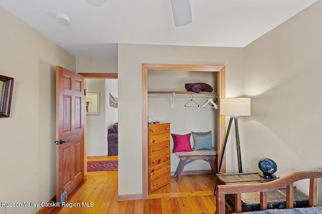 bedroom featuring a closet, ceiling fan, and light wood-type flooring