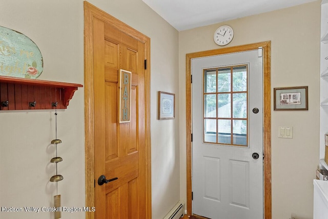 entryway featuring a baseboard heating unit