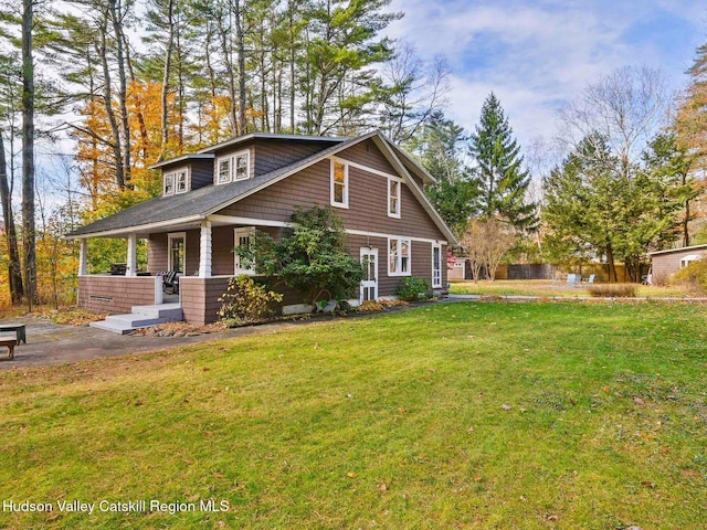 view of front of home with a front lawn and covered porch