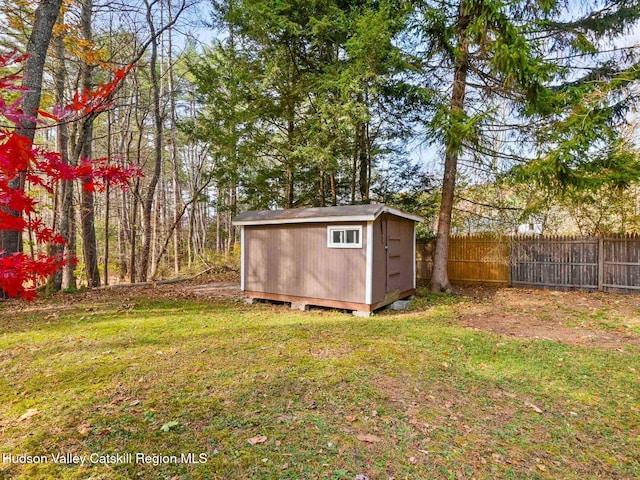 view of outbuilding featuring a yard