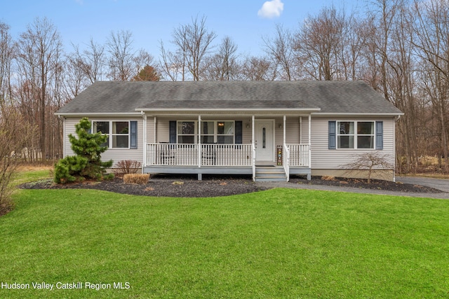 ranch-style home with a front lawn, a shingled roof, and covered porch