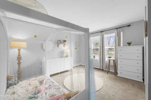 carpeted bedroom with baseboard heating