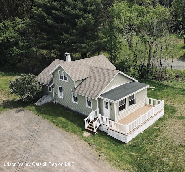 view of subject property with a heavily wooded area