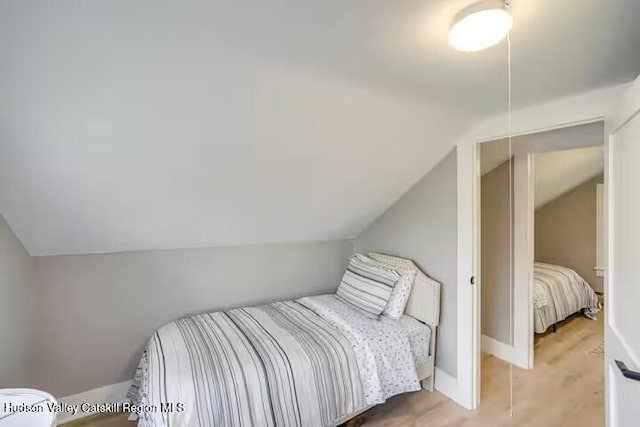 bedroom featuring vaulted ceiling