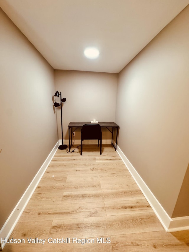office featuring wood finished floors and baseboards