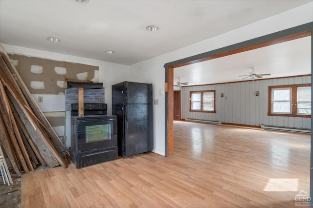 kitchen featuring black appliances, a baseboard radiator, a ceiling fan, light wood-type flooring, and exhaust hood