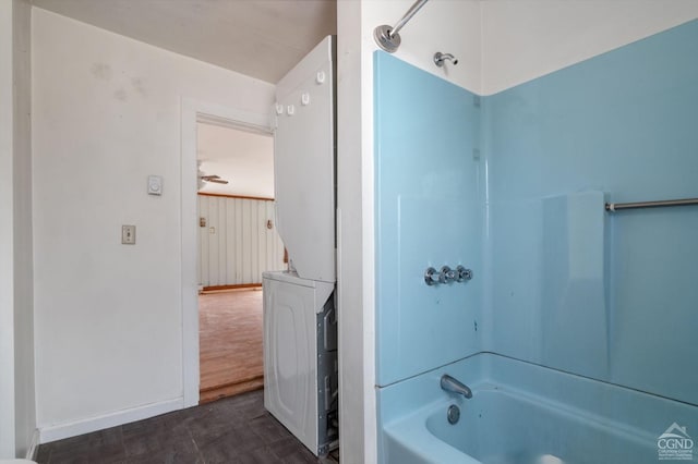 full bath featuring shower / tub combination and baseboards