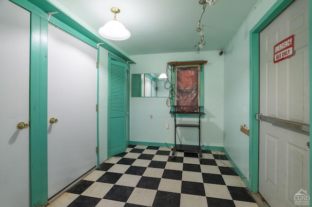 hallway with tile patterned floors