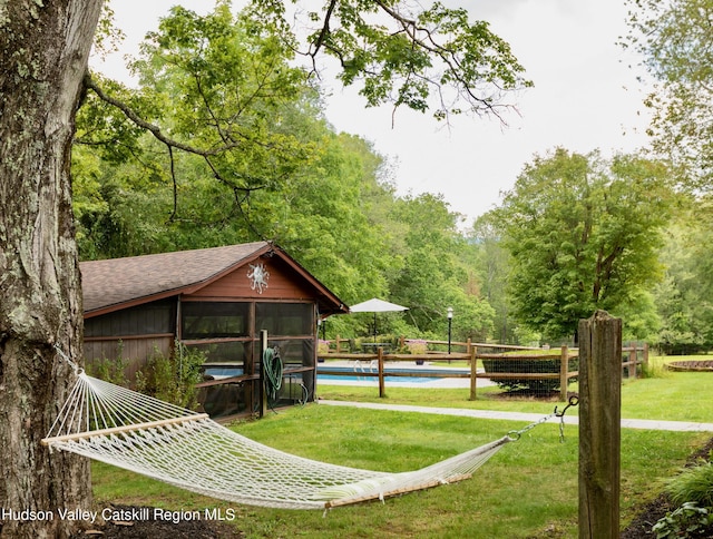 view of home's community featuring a lawn