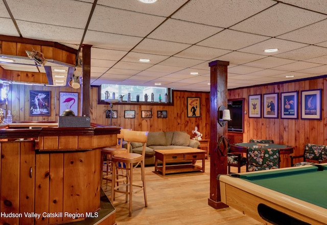 game room featuring wooden walls, a drop ceiling, billiards, and light wood-type flooring