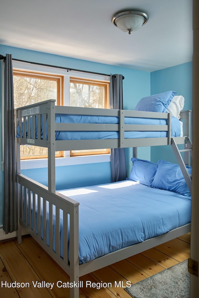 bedroom featuring wood finished floors