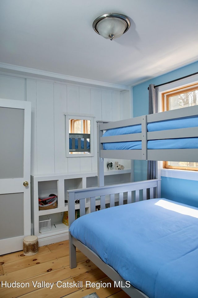 bedroom with wood finished floors