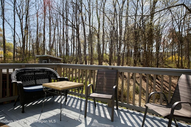 view of wooden balcony featuring a wooden deck