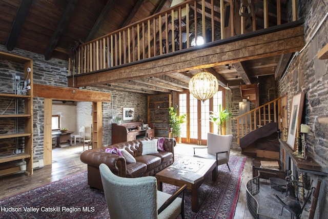 18 Striebel Rd, Woodstock, NY 12498 - living room with plenty of natural light, a chandelier, a high ceiling, and hardwood / wood-style flooring