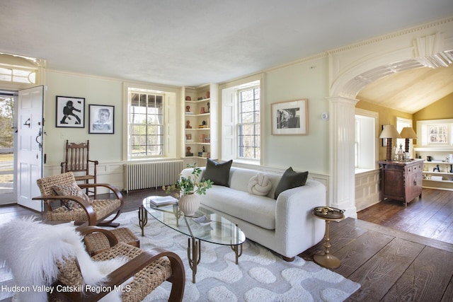 18 Striebel Rd, Woodstock, NY 12498 - living room with radiator, a wainscoted wall, dark wood-style floors, and a wealth of natural light