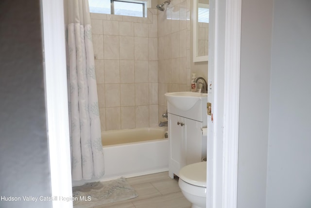 full bathroom featuring vanity, toilet, and shower / bath combo with shower curtain