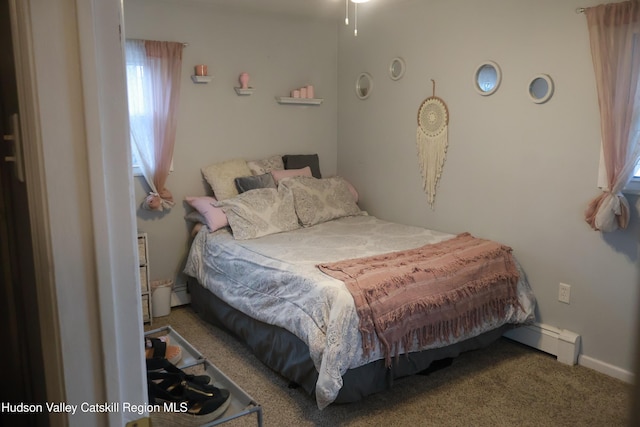 bedroom with carpet and a baseboard radiator