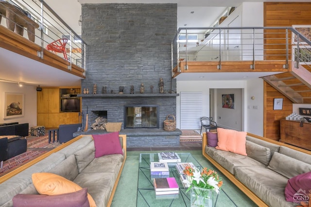 5015 Crow Hill Rd, Austerlitz, NY 12165 - living room featuring a high ceiling, a fireplace, and stairway