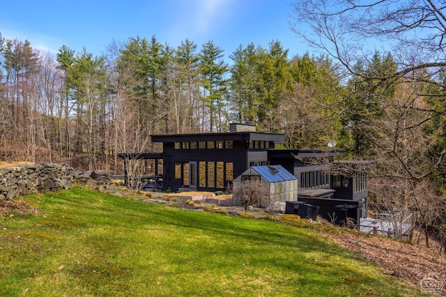 5015 Crow Hill Rd, Austerlitz, NY 12165 - rear view of property with a lawn and a chimney