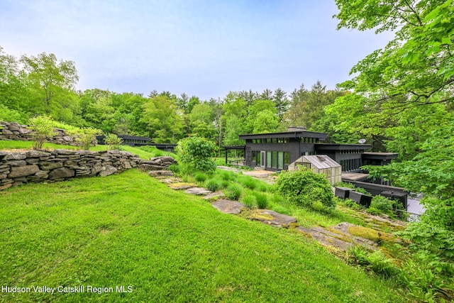 5015 Crow Hill Rd, Austerlitz, NY 12165 - view of grassy yard featuring a vegetable garden and a forest view