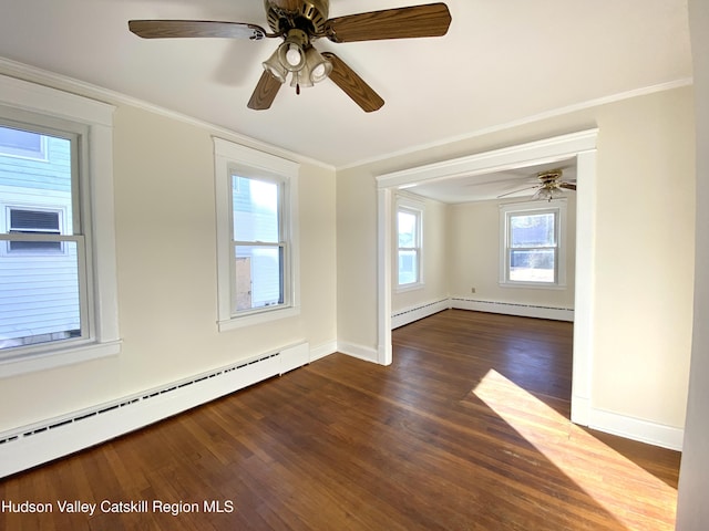 spare room featuring dark hardwood / wood-style flooring, a baseboard radiator, ceiling fan, and crown molding