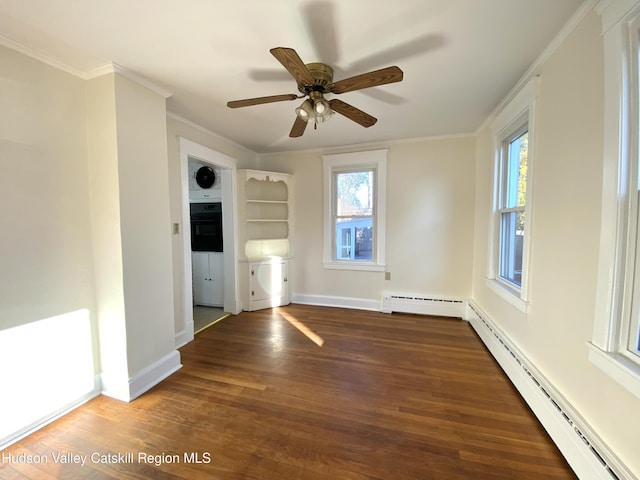 unfurnished living room featuring ceiling fan, dark hardwood / wood-style flooring, crown molding, and a baseboard heating unit