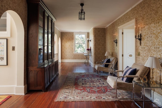 152 William St, Catskill, NY 12414 - hall featuring wallpapered walls, arched walkways, dark wood-style floors, ornamental molding, and baseboards