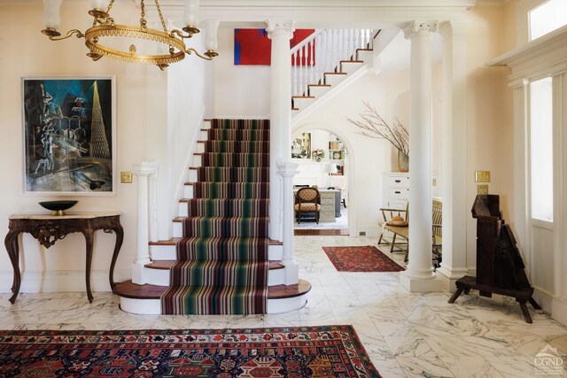 152 William St, Catskill, NY 12414 - entrance foyer with ornate columns, stairs, marble finish flooring, and a high ceiling
