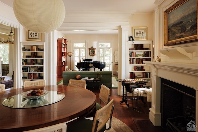 152 William St, Catskill, NY 12414 - dining area featuring dark wood-style flooring, a fireplace with flush hearth, crown molding, and built in features