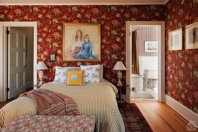 152 William St, Catskill, NY 12414 - bedroom with hardwood / wood-style floors, wallpapered walls, baseboards, and ensuite bathroom