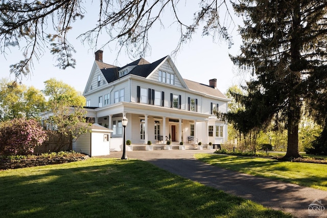 152 William St, Catskill, NY 12414 - rear view of property with a porch, a chimney, and a lawn
