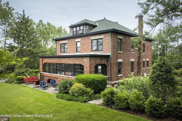 4170 Rte 9w, West Camp, NY 12477 - view of front of home featuring brick siding, a front yard, a patio, a chimney, and outdoor lounge area