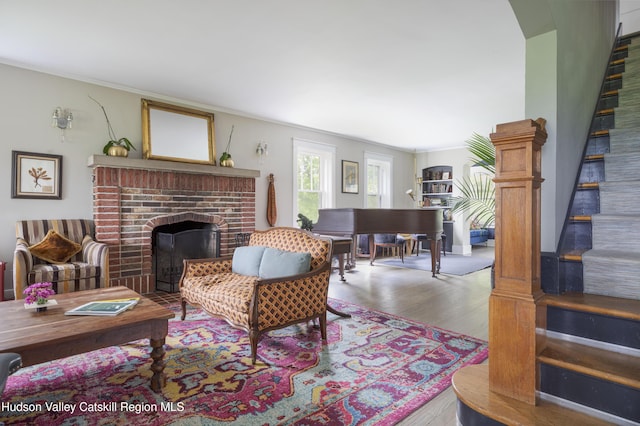 4170 Rte 9w, West Camp, NY 12477 - living room with a brick fireplace, wood finished floors, and stairs