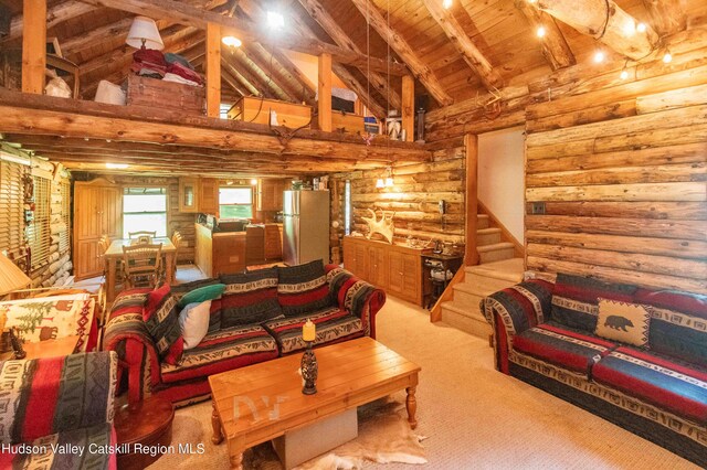 living room with rustic walls, light colored carpet, beam ceiling, high vaulted ceiling, and wooden ceiling