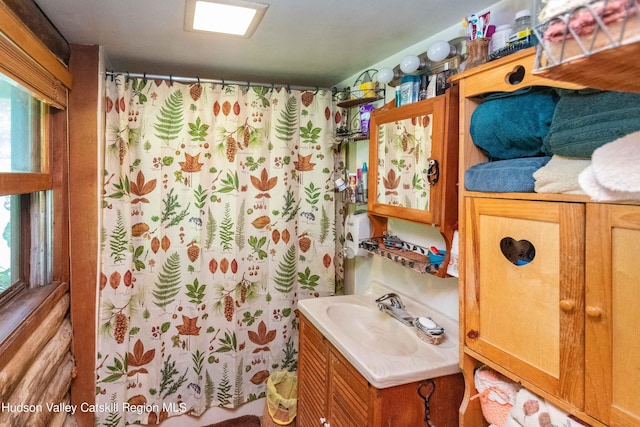 bathroom featuring vanity and walk in shower