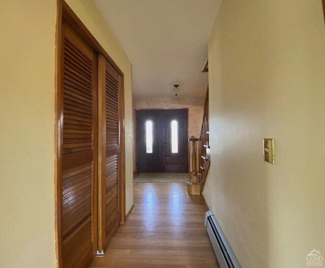 20 Joslen Pl, Hudson, NY 12534 - corridor featuring baseboard heating and wood finished floors