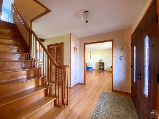20 Joslen Pl, Hudson, NY 12534 - entrance foyer with light wood-type flooring, baseboards, and stairs