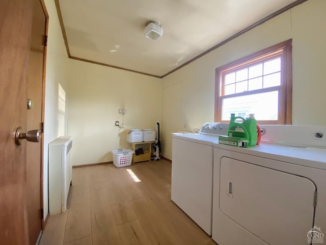 20 Joslen Pl, Hudson, NY 12534 - laundry area with washer and dryer, ornamental molding, light wood-style flooring, and radiator heating unit