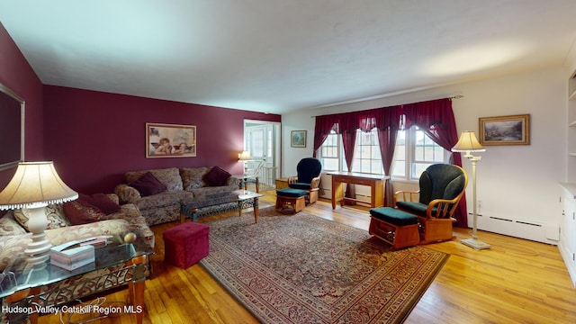 living room featuring light wood-type flooring and baseboard heating