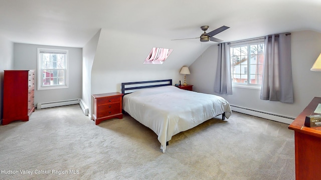 carpeted bedroom featuring multiple windows, vaulted ceiling, ceiling fan, and baseboard heating