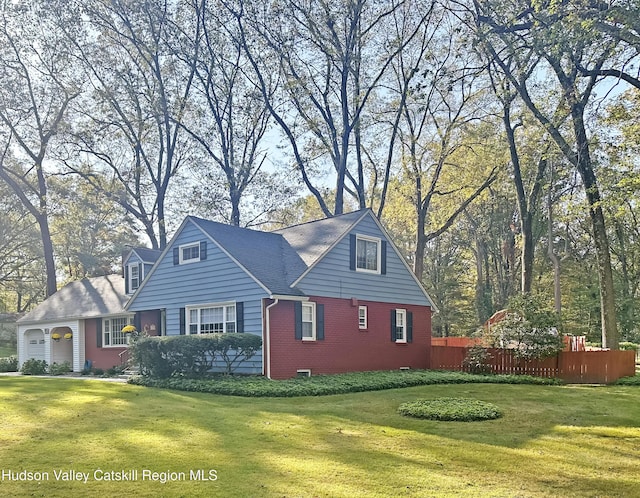 view of side of home with a garage and a lawn